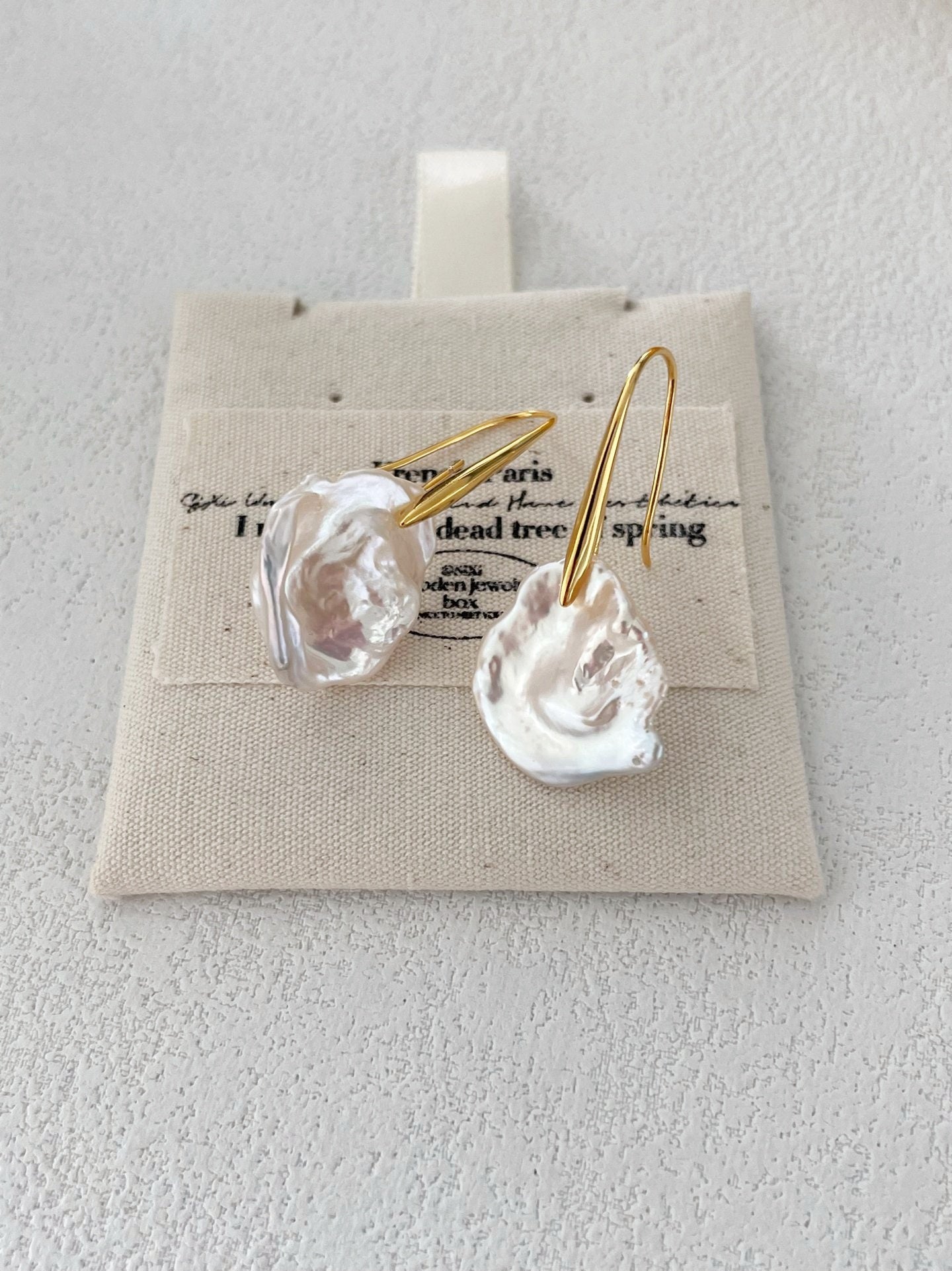 Hook earrings with baroque petal pearls