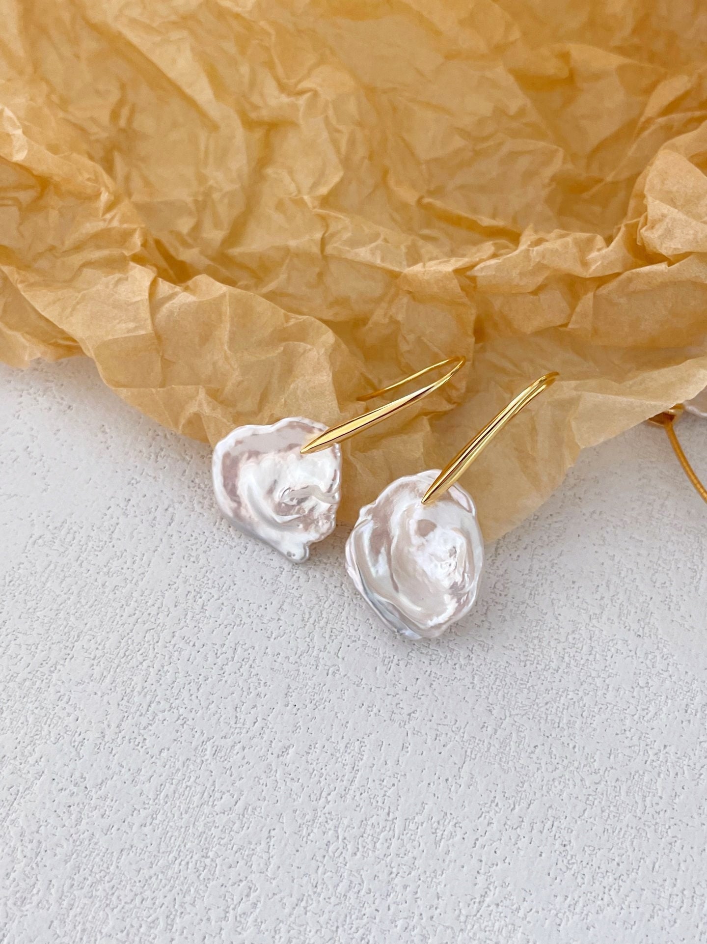 Hook earrings with baroque petal pearls