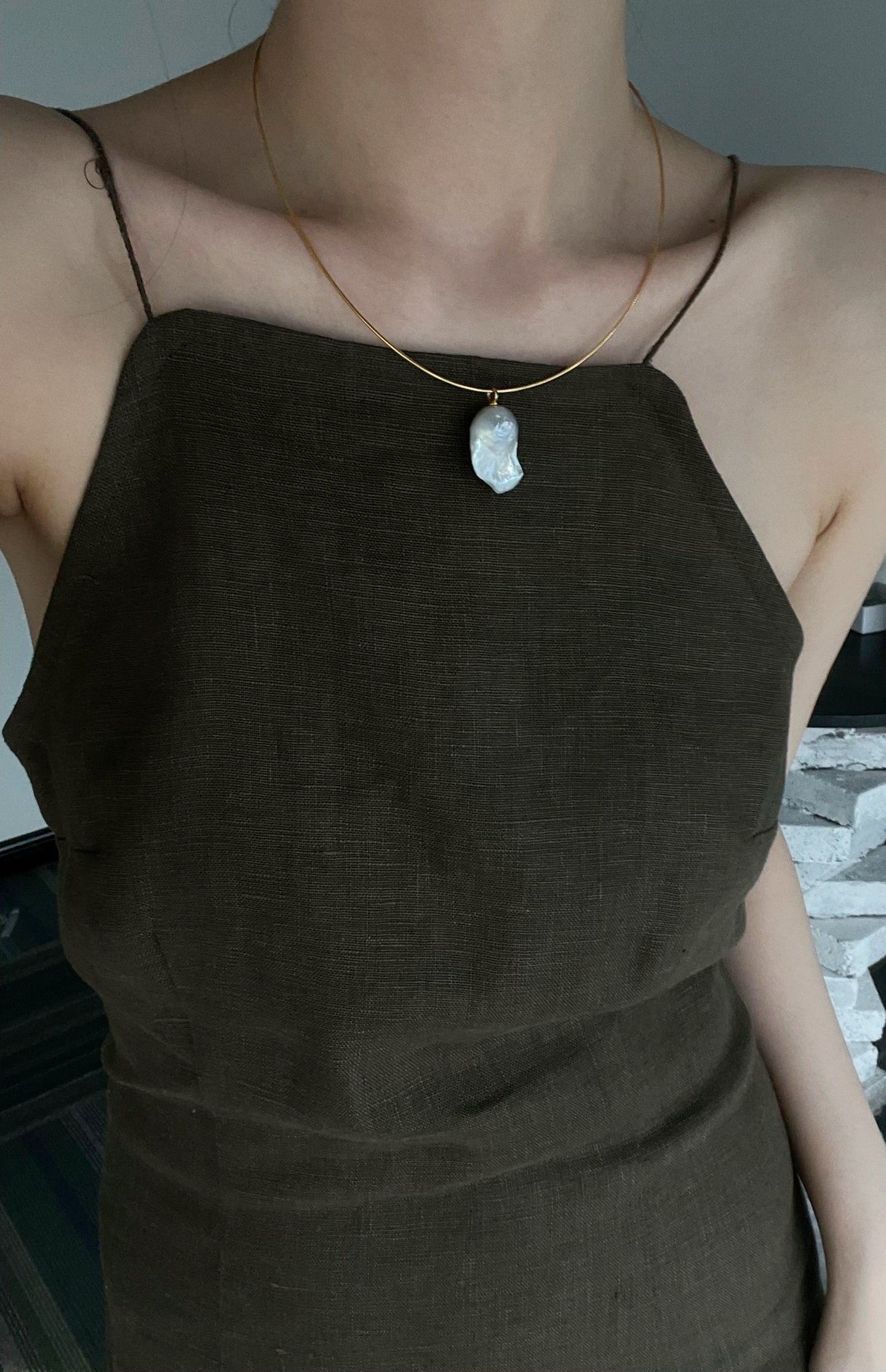 Gold choker with large baroque