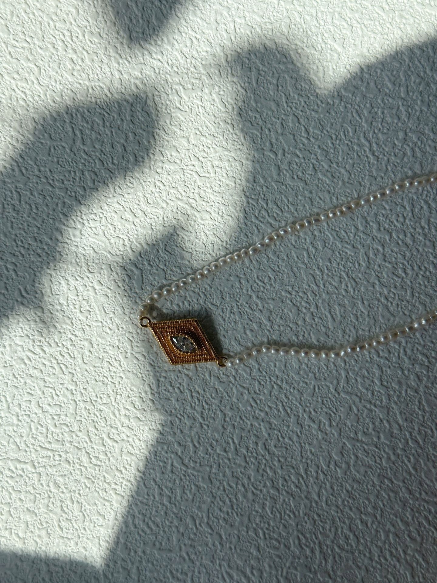Collana di perle con occhio greco