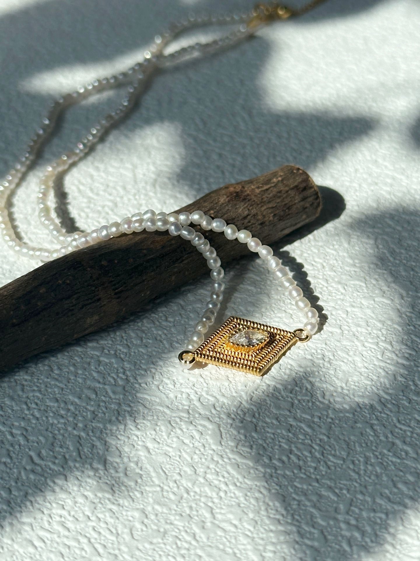 Collana di perle con occhio greco