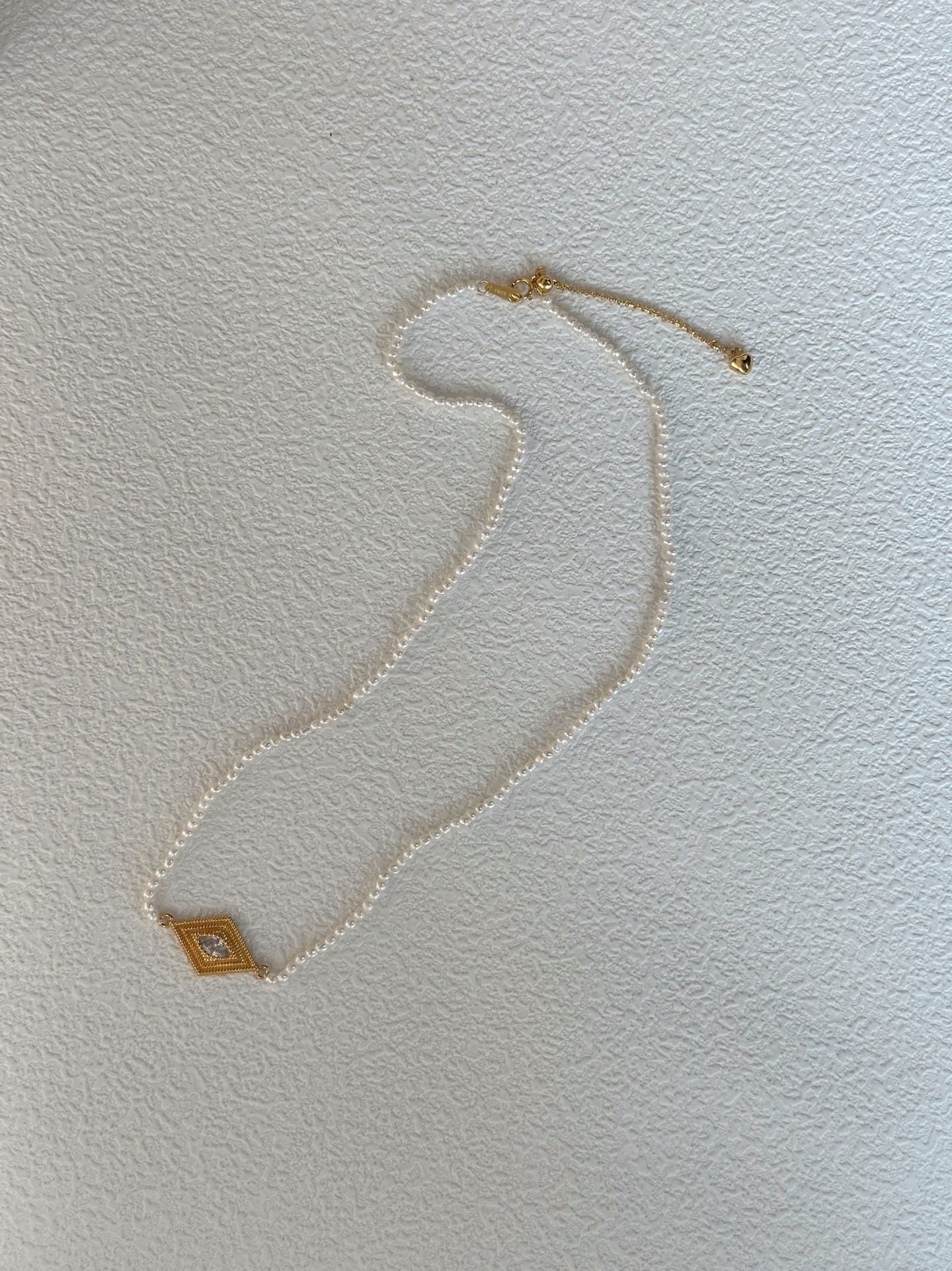 Collana di perle con occhio greco