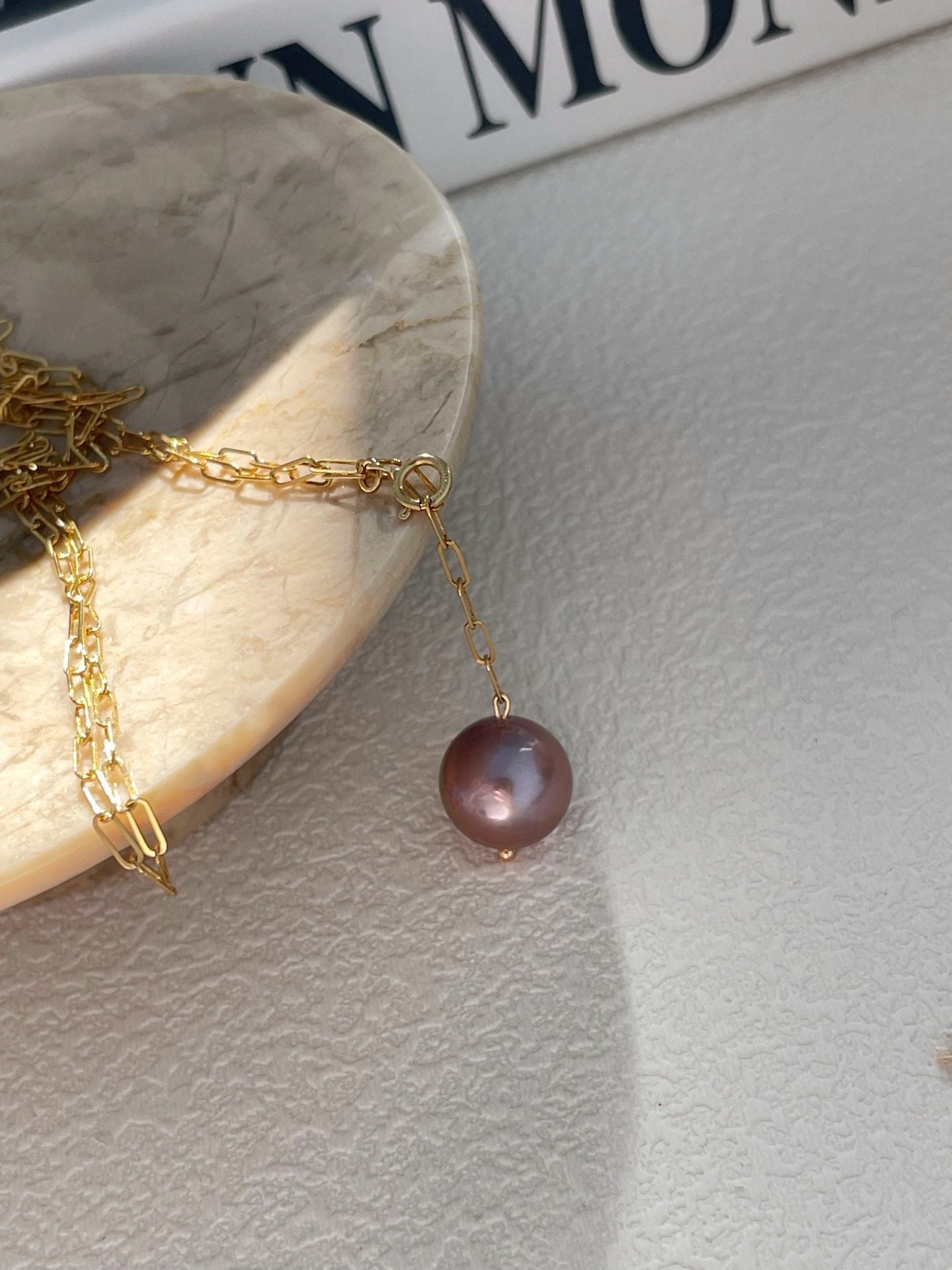 Collana di perla viola