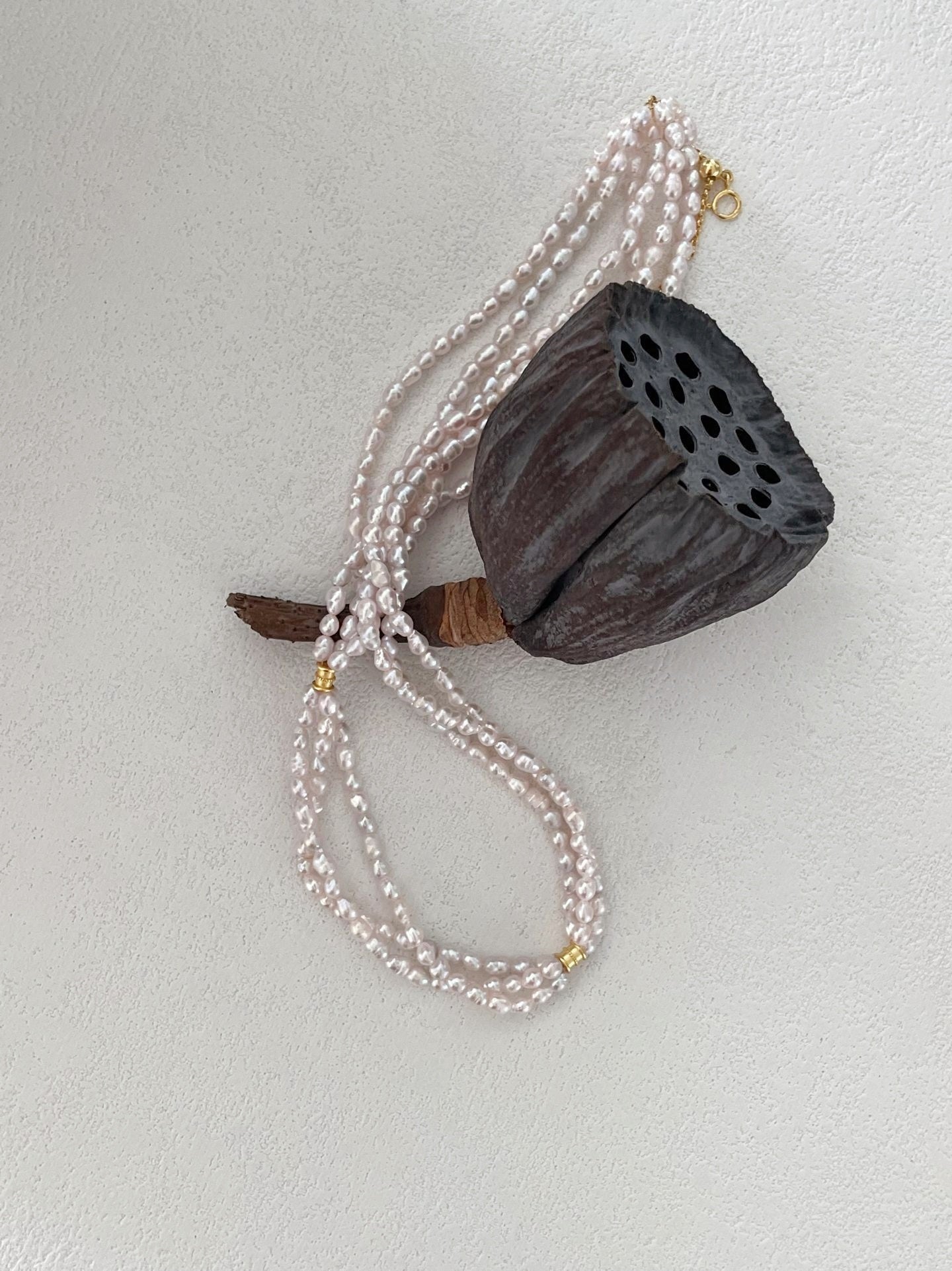 Collier di perle a tre fili