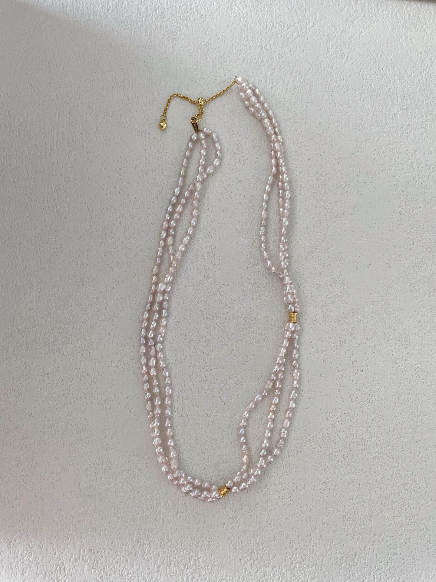 Collier di perle a tre fili