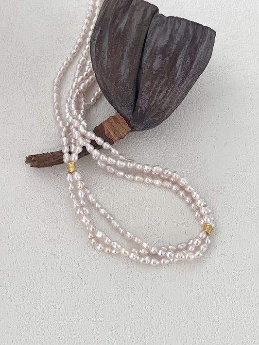 Collier di perle a tre fili