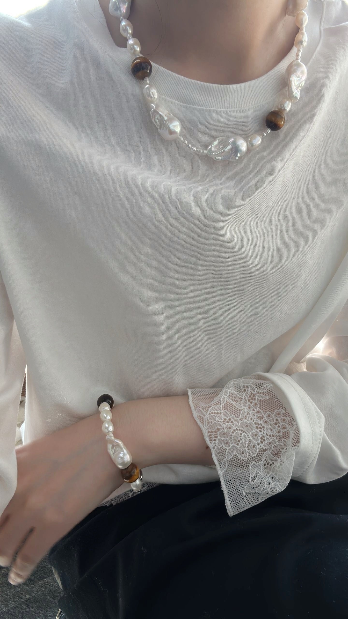 Collana di ambra e barocche
