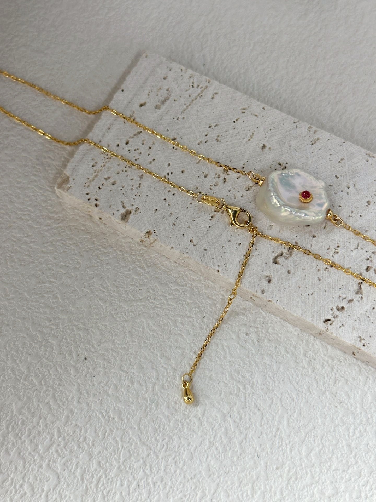 Collana di perle con malocchio