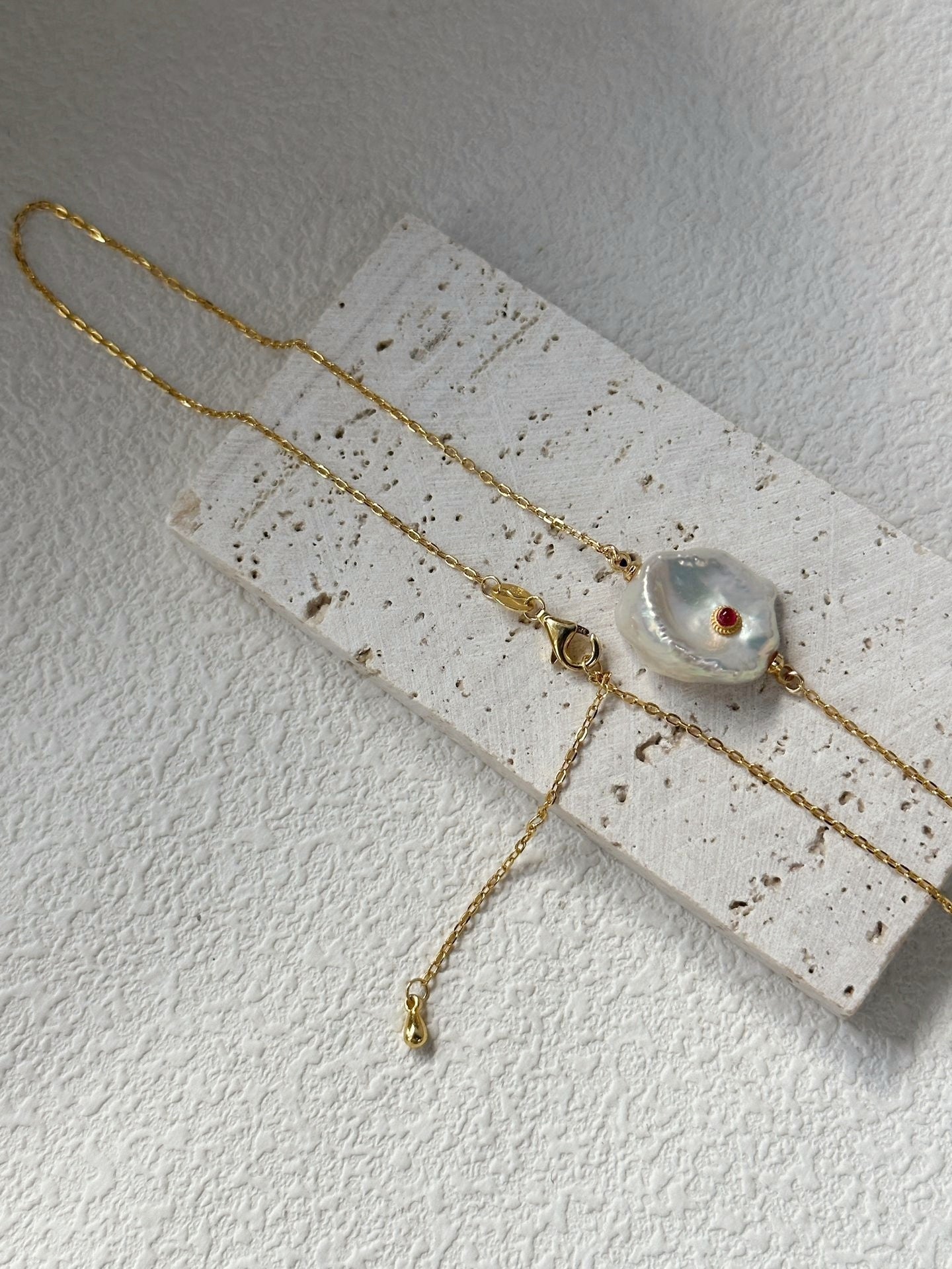 Collana di perle con malocchio