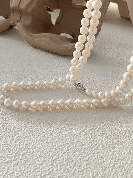 Collana lunga di perle filettate